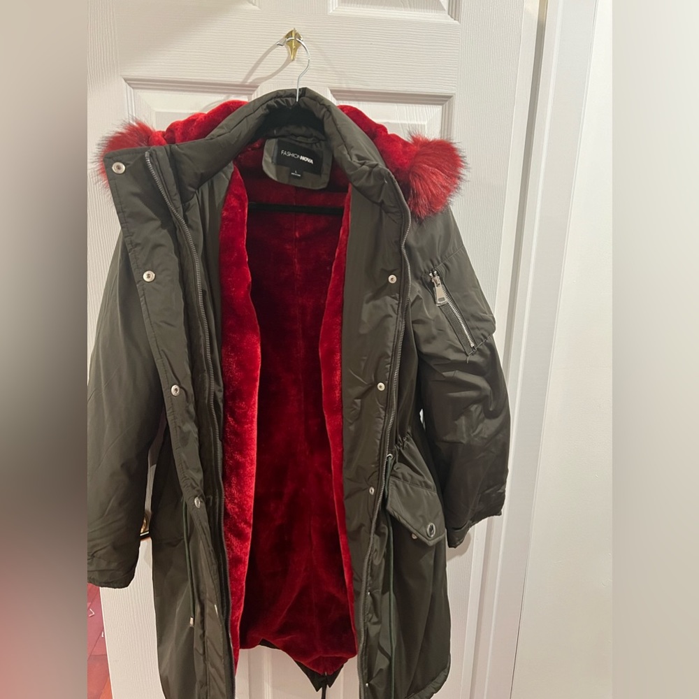 NWOT winter coat with faux fur inside.